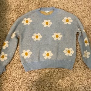 Light blue sweater with white flowers